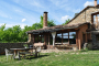 Front of the property gardens with rustic table